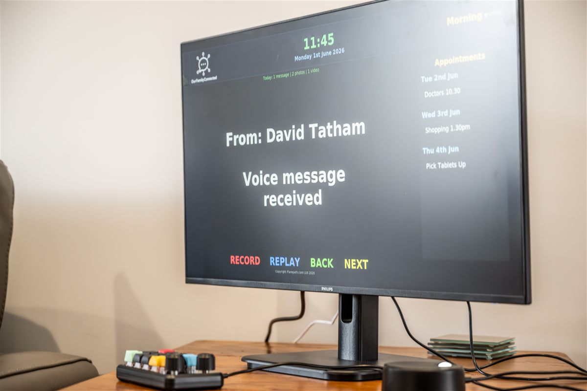 OurFamilyConnected screen showing dementia-friendly clock display
